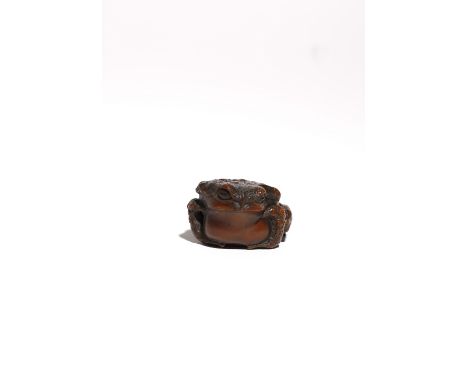 A LARGE JAPANESE BOXWOOD NETSUKE OF A TOAD MEIJI PERIOD, 19TH CENTURY The amphibian realistically carved with leathery-lookin