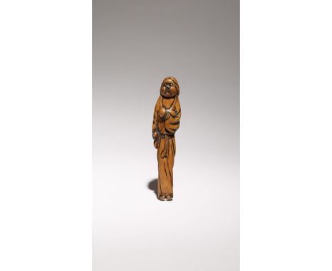 A JAPANESE SHUNGA EROTIC BOXWOOD SASHI NETSUKE EDO PERIOD, 18TH OR 19TH CENTURY The well-worn surface carved as Okame, the Go