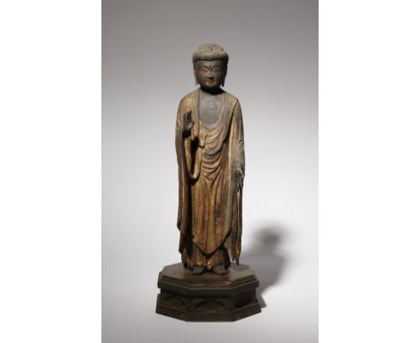 A JAPANESE LACQUERED WOOD FIGURE OF AMIDA NYORAI (AMIDA BUDDHA) MUROMACHI PERIOD OR LATER, 16TH CENTURY OR LATER Standing on 