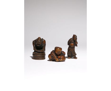 THREE JAPANESE WOOD NETSUKE MEIJI PERIOD, 19TH CENTURY The first carved as the Chinese General Kan'u clutching his beard whil