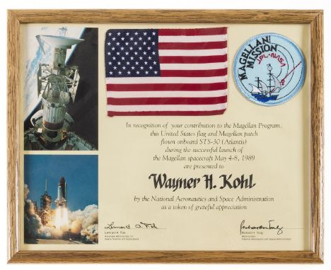 ** Flown U.S. Flag.-  Presentation certificate awarded to Wayne Kohl including a U.S. flag and Magellan cloth patch both flow