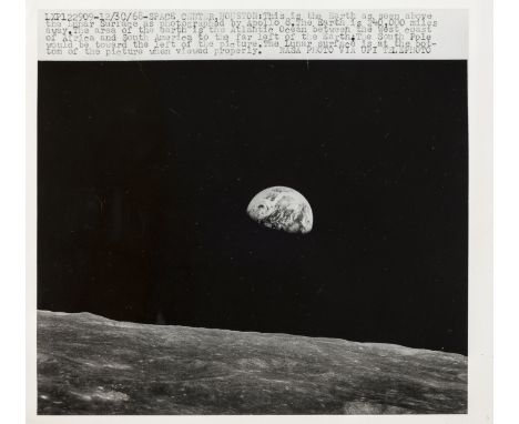 ** Apollo 8.-  Earthrise above the lunar surface, December 1968, vintage gelatin silver press print, U.P.I caption dated 30/1