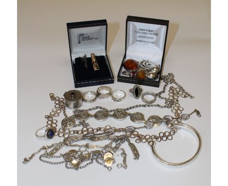 A collection of sterling silver jewellery and 925 marked jewellery. TO include rings, amber set pieces, a hallmarked torc ban