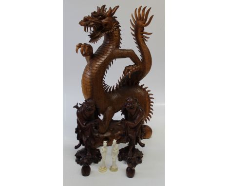 A pair of Chinese carved figures of deities, laughing holding a rat, formerly fitted as a lamp base, light fitting removed, t