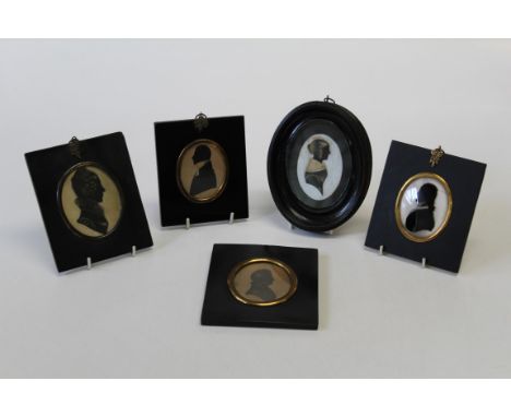19th century English School, a silhouette portrait miniature of a lady with tied hair and fur collar, ink heightened with gil