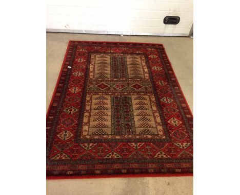 A vintage red & cream patterned wool rug /carpet. Approx 200 x 140cm - no fringing.