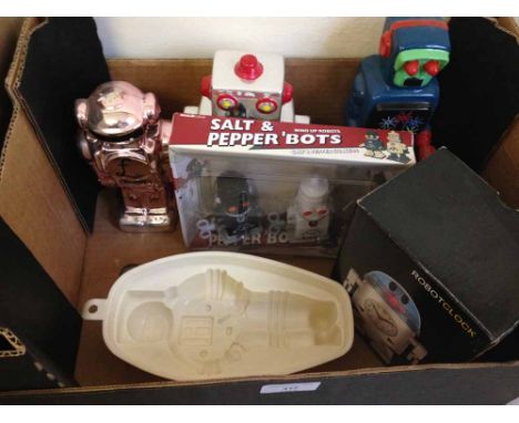 2 ceramic robot money boxes together with a ceramic robot figure, robot clock, astronaut mould and robot salt & pepper shaker