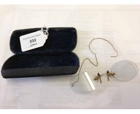 A pair of vintage gold spectacles with ear clip - cased.