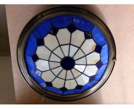 A blue & white Tiffany style lamp shade.