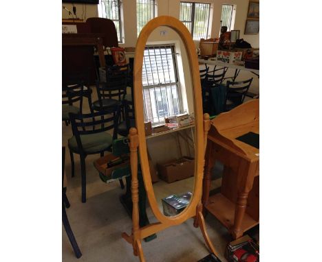 Light wood oval cheval mirror, 150cm tall.