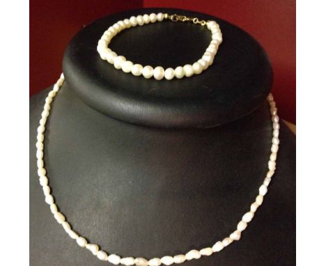 A freshwater pearl necklace and a pearl bracelet.