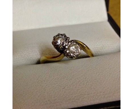 An 18ct gold & diamond ring set with 2 diamonds, each stone approx 0.2 carat. Size K.