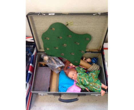 A vintage Globetrotter suitcase containing a quantity of old toys to include wooden chess set (complete), 4 dressed Barbie do