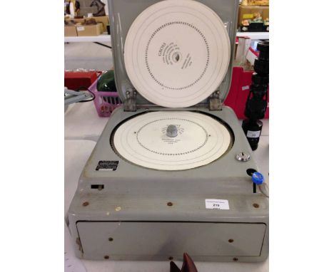 A c1950s Gross cash register with unused paper recorder discs.