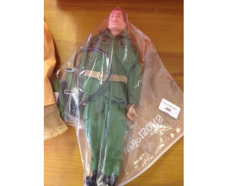 An original 1960s Action Man in Green Beret uniform with flamethrower.