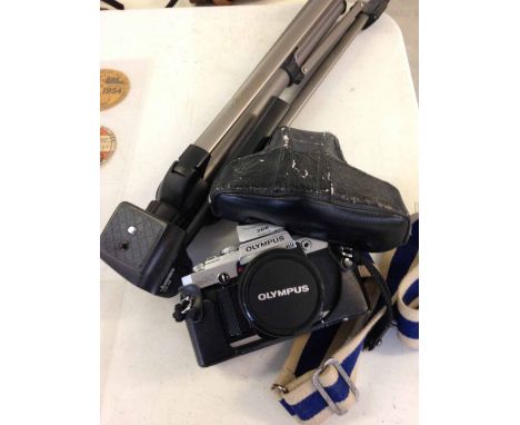 An Olympus OM30 SLR camera with 50mm lens and vianco tripod