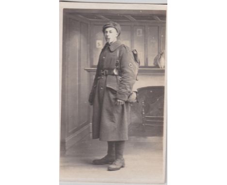 Stretcher Bearer WWI British Royal Fusilier Postcard, identified by the Red Cross patch sewn onto the sleeve of the Soldiers 