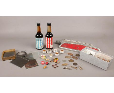 A group of collectables. Two Henderson's Relish (2003 full), Badges Ducati, Marie Curie, Winnie the Pooh examples etc,  vinta