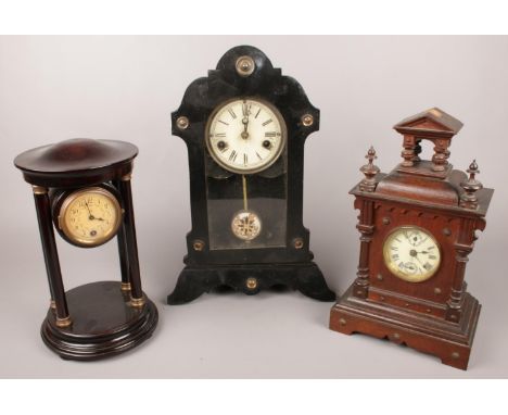 Three 8 day mantel clocks. Including Hamburg example, etc.  Front leg of tallest clock loose.
