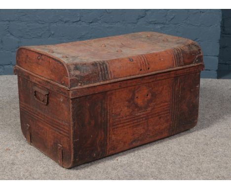 A vintage twin handle tin trunk.  Missing lock.