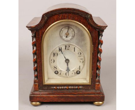 A Winterhalder &amp; Hofmeier  oak cased 8 day mantel clock with barley twist columns. Movement marked W&amp;H SCH.  