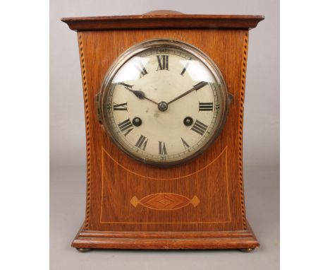 A Philip Haas &amp; Sohne inlaid oak 8 day mantel clock. Movement marked PHS.  