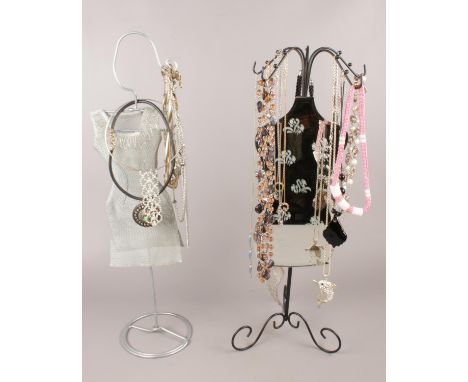 Two mannequin jewellery shop displays with contents of costume jewellery.  