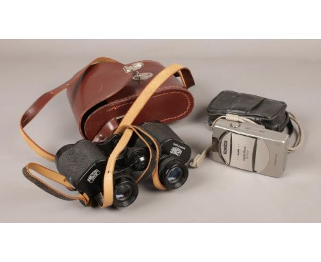 A cased pair of Carl Zeiss Jena binoculars and a Konica digital camera.  