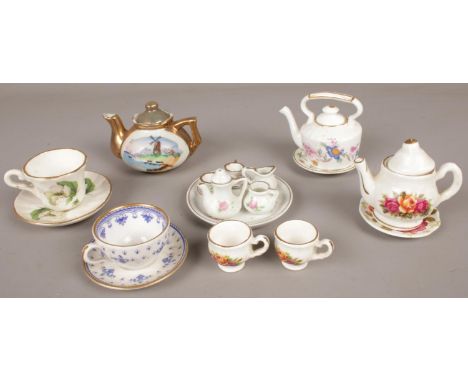 A quantity of miniature ceramic teawares. Including full teaset, cups &amp; saucers, teapots, etc.  