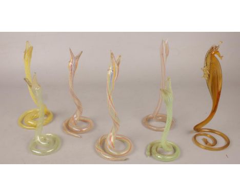 A quantity of art glass snakes along with a similar art glass sea horse.  