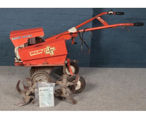 A Merry Tiller Super Major garden tractor. Includes rotovator blades and manual.  Not running.