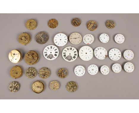 An assortment of pocket watch movements &amp; enamel dials.  