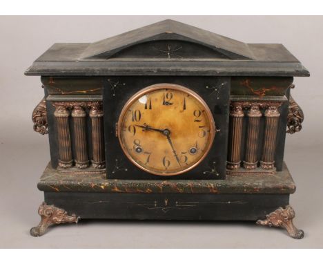 An ornate Wm.L. Gilbert marble effect 8 day mantel clock. Chiming on a coil gong.  