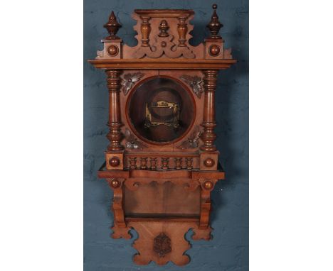 A carved mahogany wall clock case.  Parts of finial missing.426