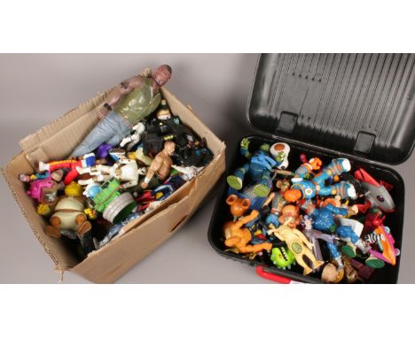 A box and a case of action figures. Includes Mattel etc.  