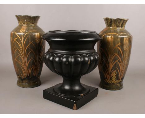 A pottery pedestal font/planter, along with a pair of pottery vases with gilt decoration.  