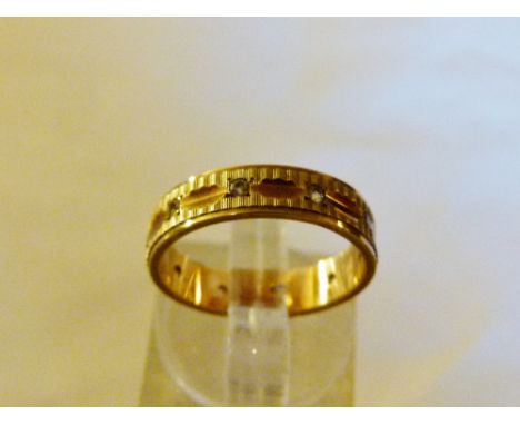  9 ct gold stone set band. Size K.