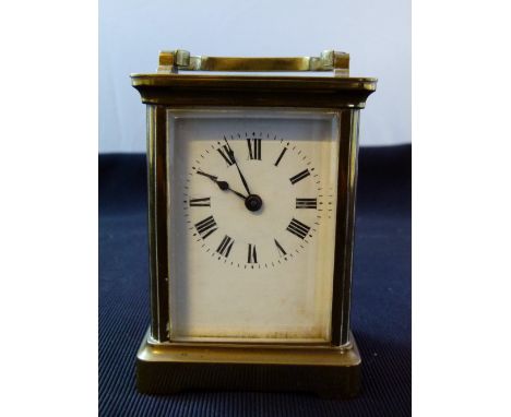 Brass carriage clock with bevelled glass panels, working at lotting up