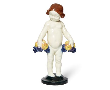 Geo Verbanck (1881-1961) Figure of a child holding fruit, early 20th century  Glazed earthenware  Stamped 'Verbanck' to base,