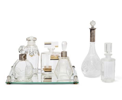 Art Deco Group of six early 20th Century decanters and an Art Deco mirrored and glass tray, circa 1920-40  Glass, white metal