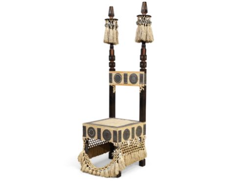 Carlo Bugatti (1856-1940) Fringed throne chair dominated by two carved wooden columns adorned with copper and tassels, circa 