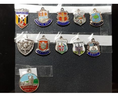 11 STERLING SILVER ENAMEL PLACE SHIELD CHARMS, ALL SCOTLAND AND HAS HALLMARKS OR  MARKED AS SILVER