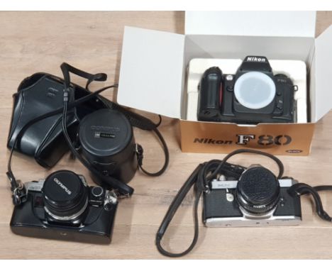 CAMERAS TO INCLUDE PENTAX MX OLYMPUS CM10 WITH SPARE 135MM LENS A NIKON F80 NO LENS. OTHER COMPACT CAMERAS AND ACCESSORIES AL