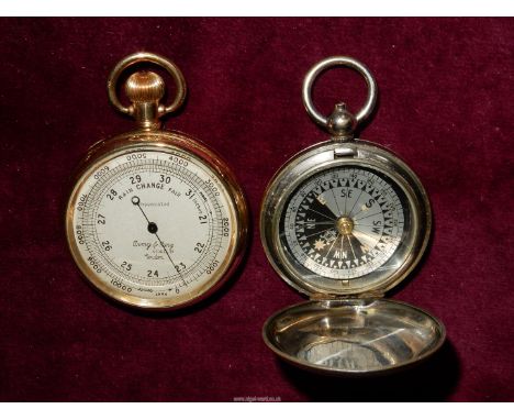 A yellow metal cased compensated Pocket Aneroid Barometer by 'Army &amp; Navy Stores Ltd, London', the crown geared to operat