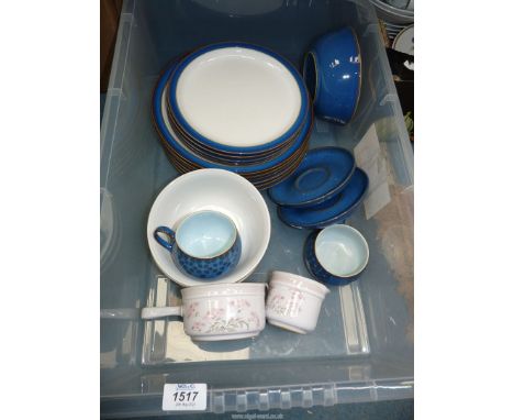 A quantity of mottled blue Denby dinnerware to include; dinner &amp; side plates, cups &amp; saucers, etc.