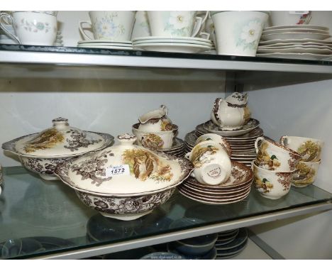 A part Royal Worcester Palissy 'Game Series' dinner service seven dinner plates, six each tea plates, cups, saucers and deser