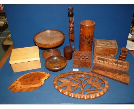 A quantity of treen including; Cribbage board, cake stand, bowl, etc.