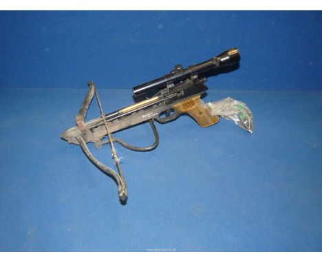 A Barnett Trident Crossbow with sights with one arrow/bolt in situ plus a tube of bow string wax.