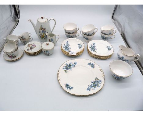 A six piece child's Teaset with scenes of ladies to include teapot, six cups and saucers, milk jug and sugar bowl, together w