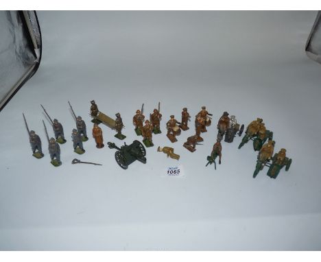 A quantity of lead WWI army figures including bugler, drummer, stretcher bearers, armed motorcycles and riders, etc.